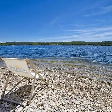 Holiday home Strandhaus Ive: Beachfront Oasis With Whirlpool And Olive Grove